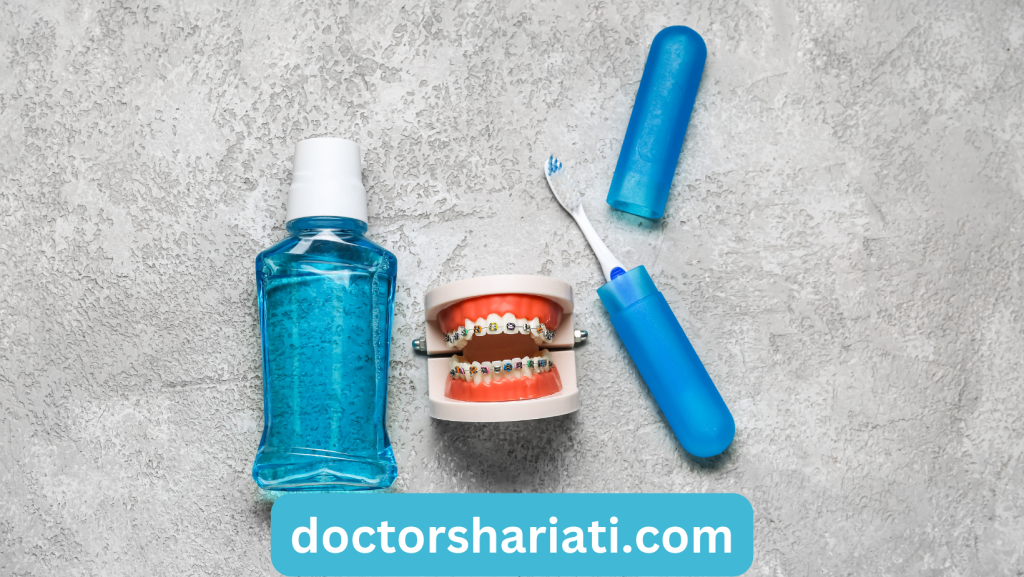 Model of Jaw with Braces, Mouthwash and Toothbrush on Grey Background